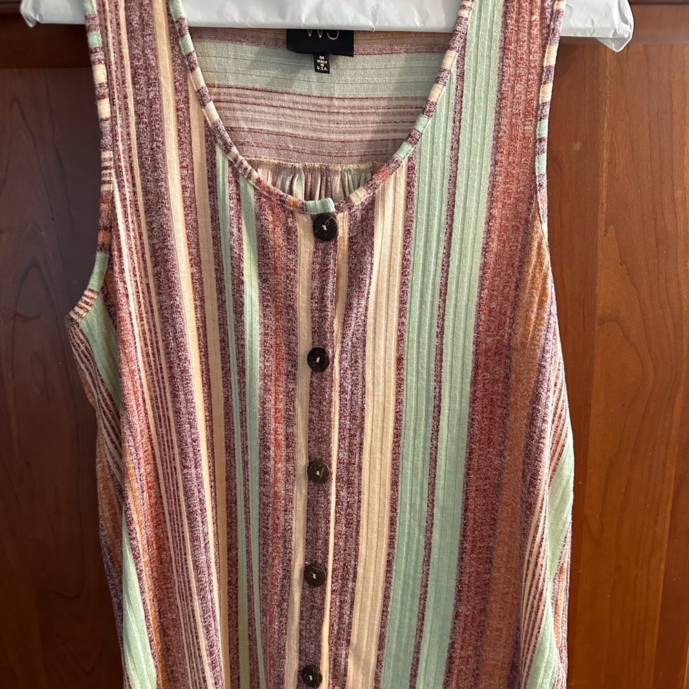 Ladies sleeveless multi color striped button down shirt